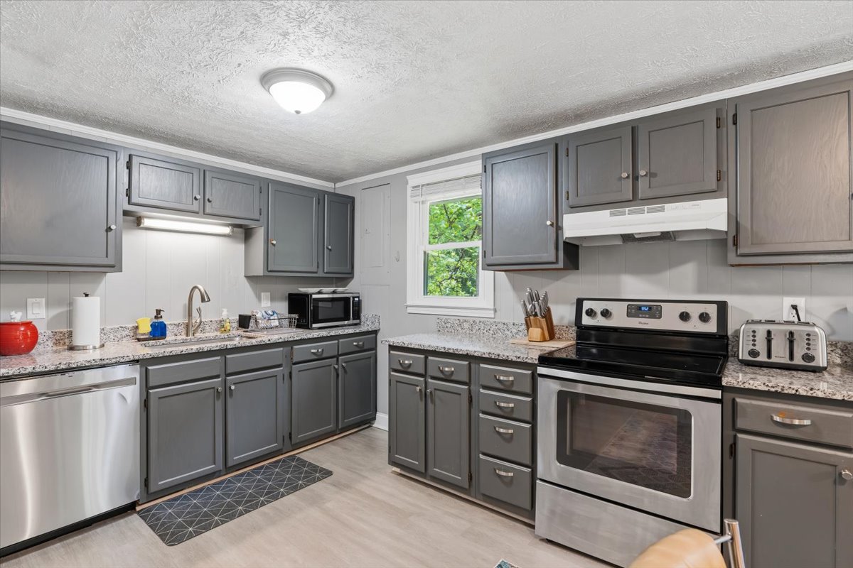 Kitchen with granite counters and stainless appliances